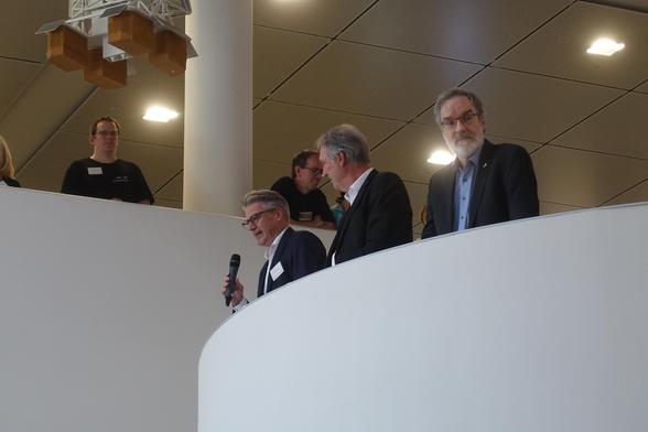 Close-up of Thorsten Kleine speaking into a microphone in his hand
