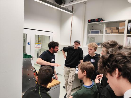 engineers explaining today's tests in our vibrational testing facility