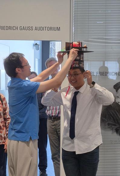 Yifeng Fu receiving his doctoral hat