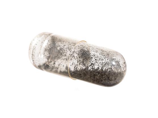 capsule with tiny crumbs of meteorite Ivuna